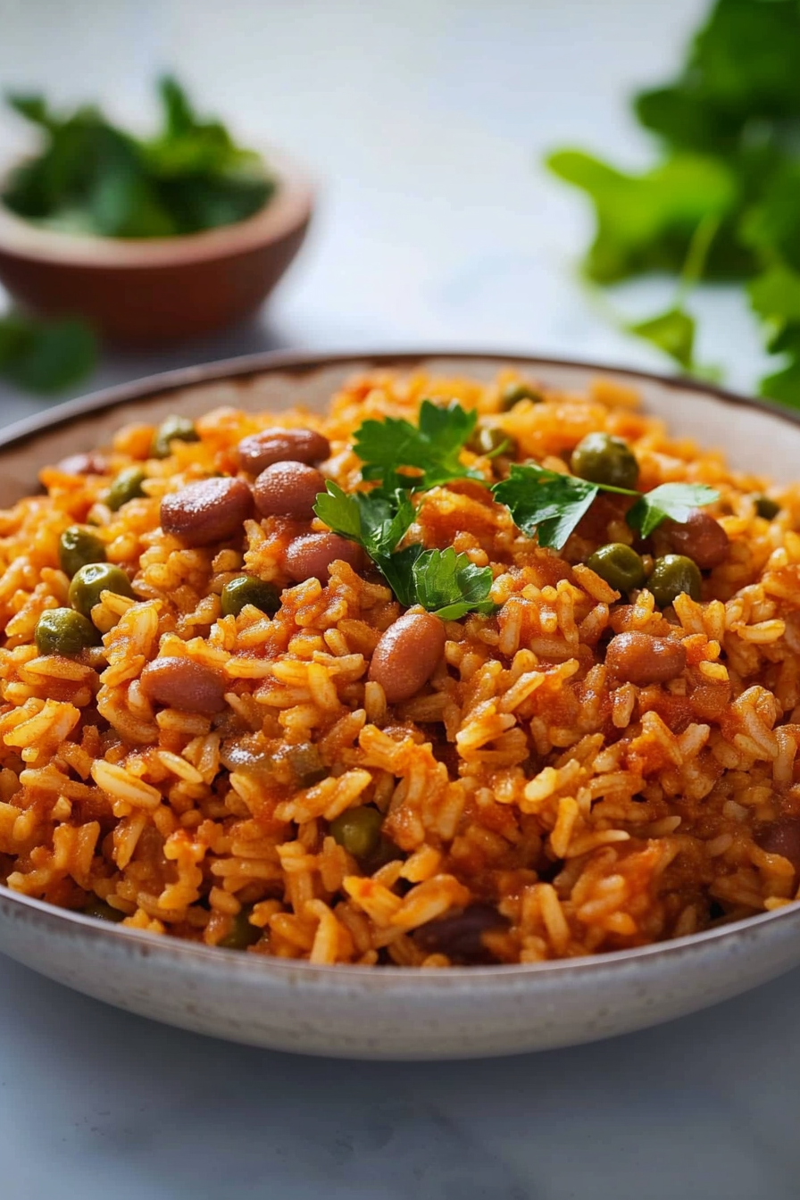 A colorful rice dish with beans and peas, topped with fresh parsley.