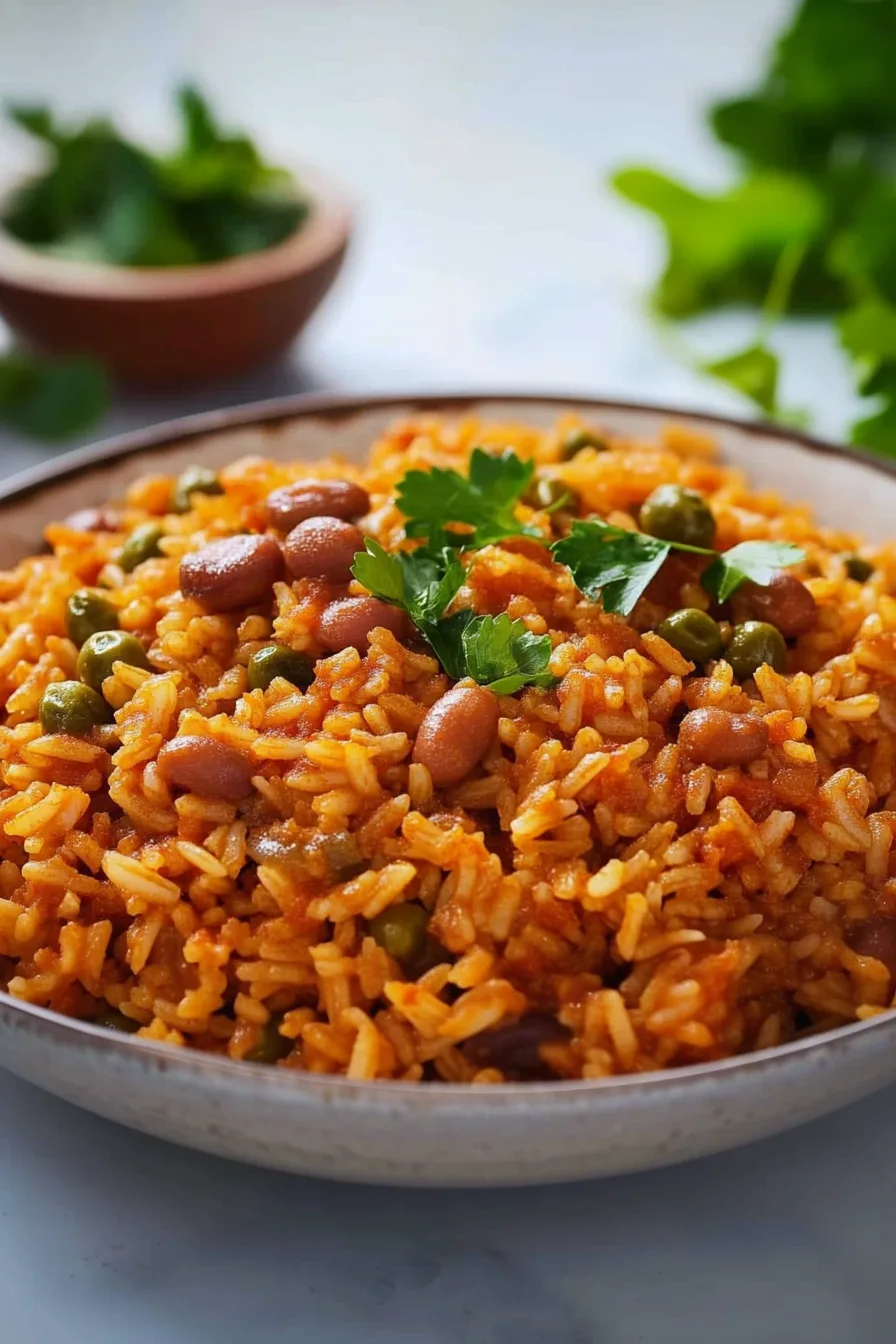 A colorful rice dish with beans and peas, topped with fresh parsley.