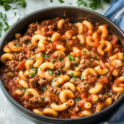Golden macaroni tossed with savory beef and peppers, finished with a sprinkle of parsley.