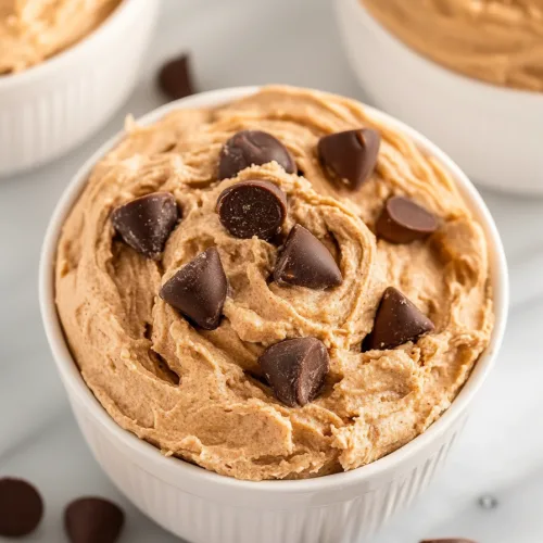 Sweet whipped treat styled with crushed cookies and dark chocolate accents.