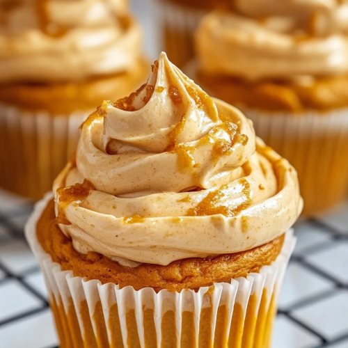 Pumpkin Whipped Cream served in a bowl, finished with a sprinkle of cinnamon.