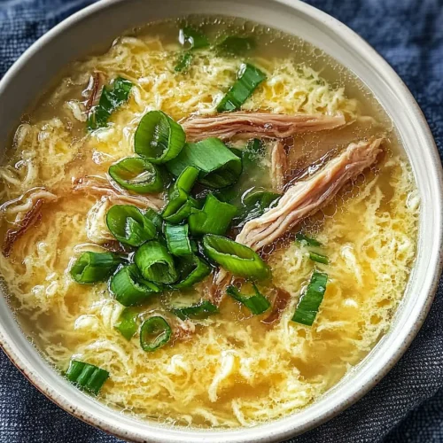 Warm bowl of soup highlighting silky texture and bright colors