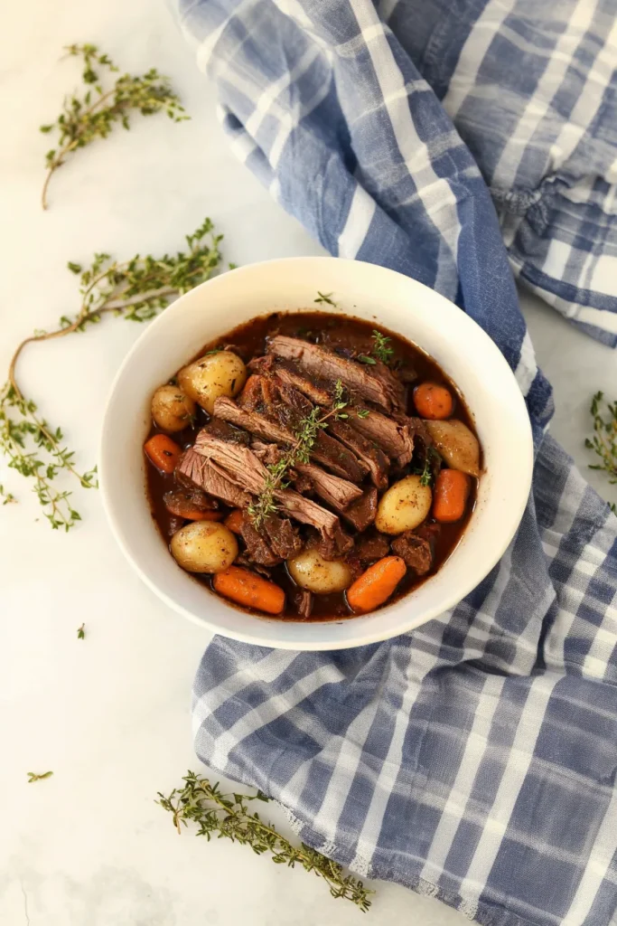 Tender beef chunks with carrots and potatoes in rich gravy.
