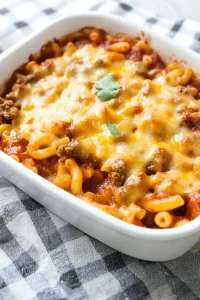 Comforting baked macaroni dish served in a white casserole pan.
