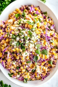 Vibrant slaw highlighting crunchy vegetables and creamy texture.