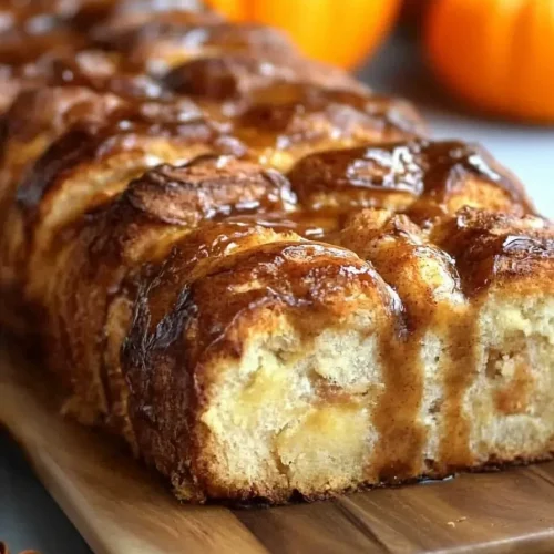 Loaf styled with small pumpkins in the background for autumn mood.