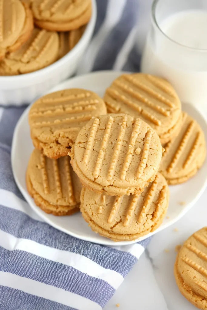 Soft, golden cookies paired with a creamy center, styled for a cozy dessert photo.