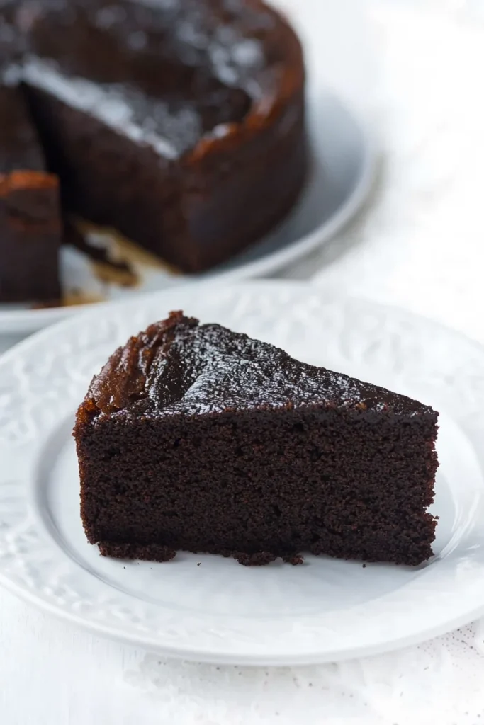 Traditional Caribbean fruit cake presented with a cut slice in front.