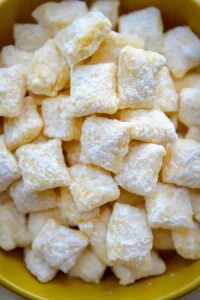 Close-up of citrus-flavored treats with a soft, powdery coating.
