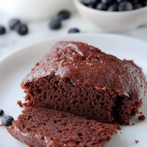 Dark chocolate cake paired with fresh blueberries for contrast.