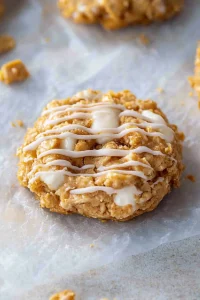 Overhead view of cookies with a drizzle of icing, emphasizing their homemade charm.