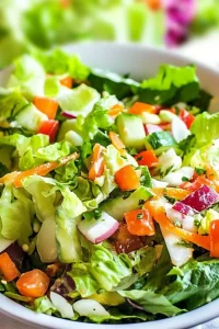 Plated bowl of garden vegetables, showcasing bright colors and crunchy textures.