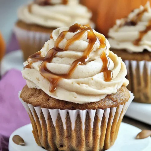 Plated cupcake surrounded by pumpkins, highlighting fall flavors.