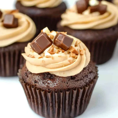 Overhead view highlighting the contrast of dark cake and light frosting.
