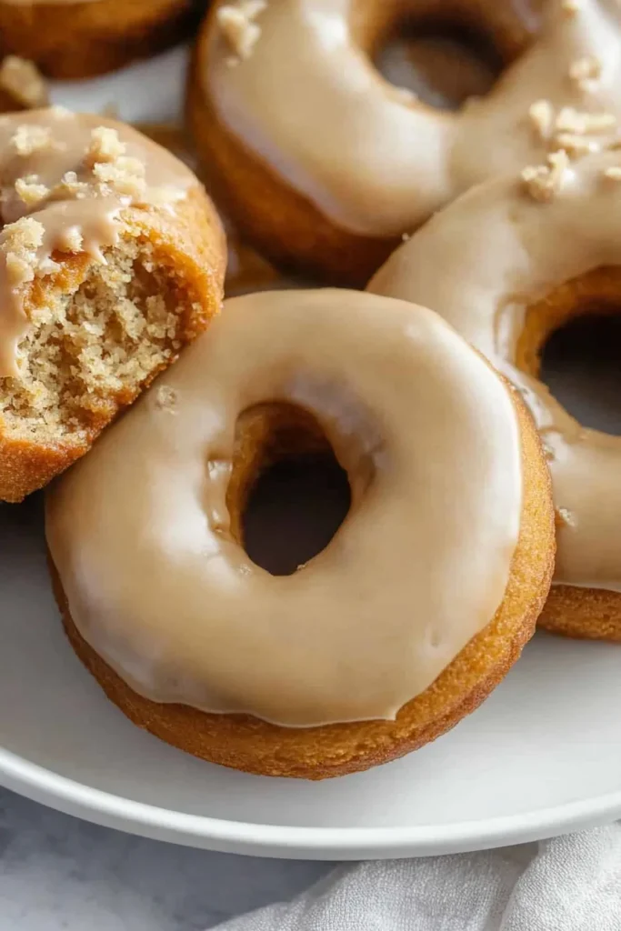 Plate of soft donuts styled for a cozy autumn treat.