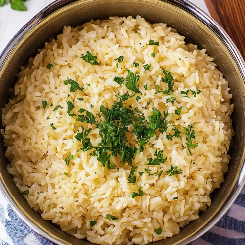 Bowl of seasoned rice with light golden color and soft texture