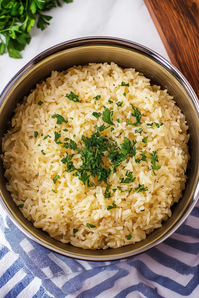 Bowl of seasoned rice with light golden color and soft texture