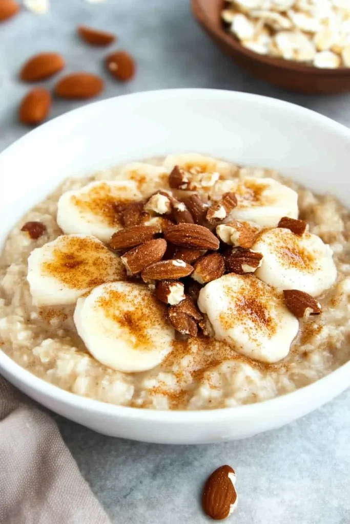 Nutritious breakfast showing creamy oats with fruit and crunchy toppings.