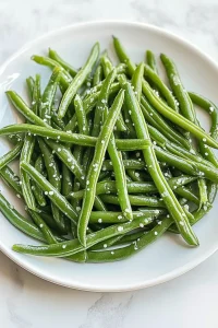 Close-up of tender beans, lightly coated with oil for shine.