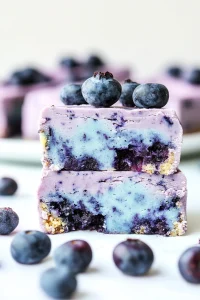 Closeโup of crumbly crust supporting a swirled purple and light blue filling.