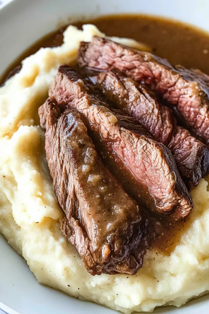 Classic homestyle dish with roast beef, gravy, and a generous potato portion.