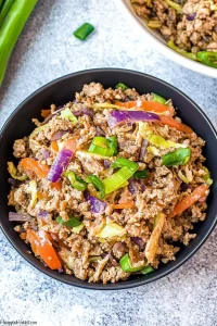 Hearty skillet mix of shredded vegetables and seasoned ground beef.