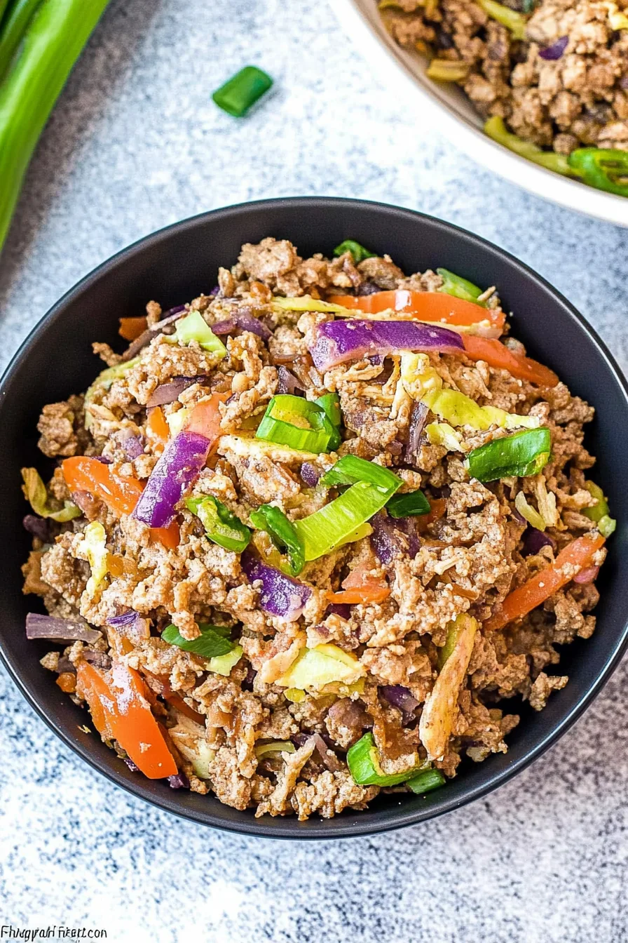 Hearty skillet mix of shredded vegetables and seasoned ground beef.