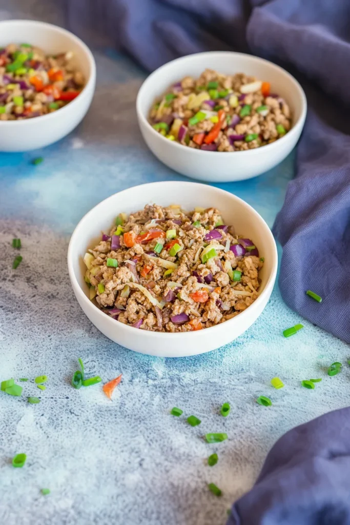 Rustic serving bowl filled with proteinโrich meat and crisp vegetables.